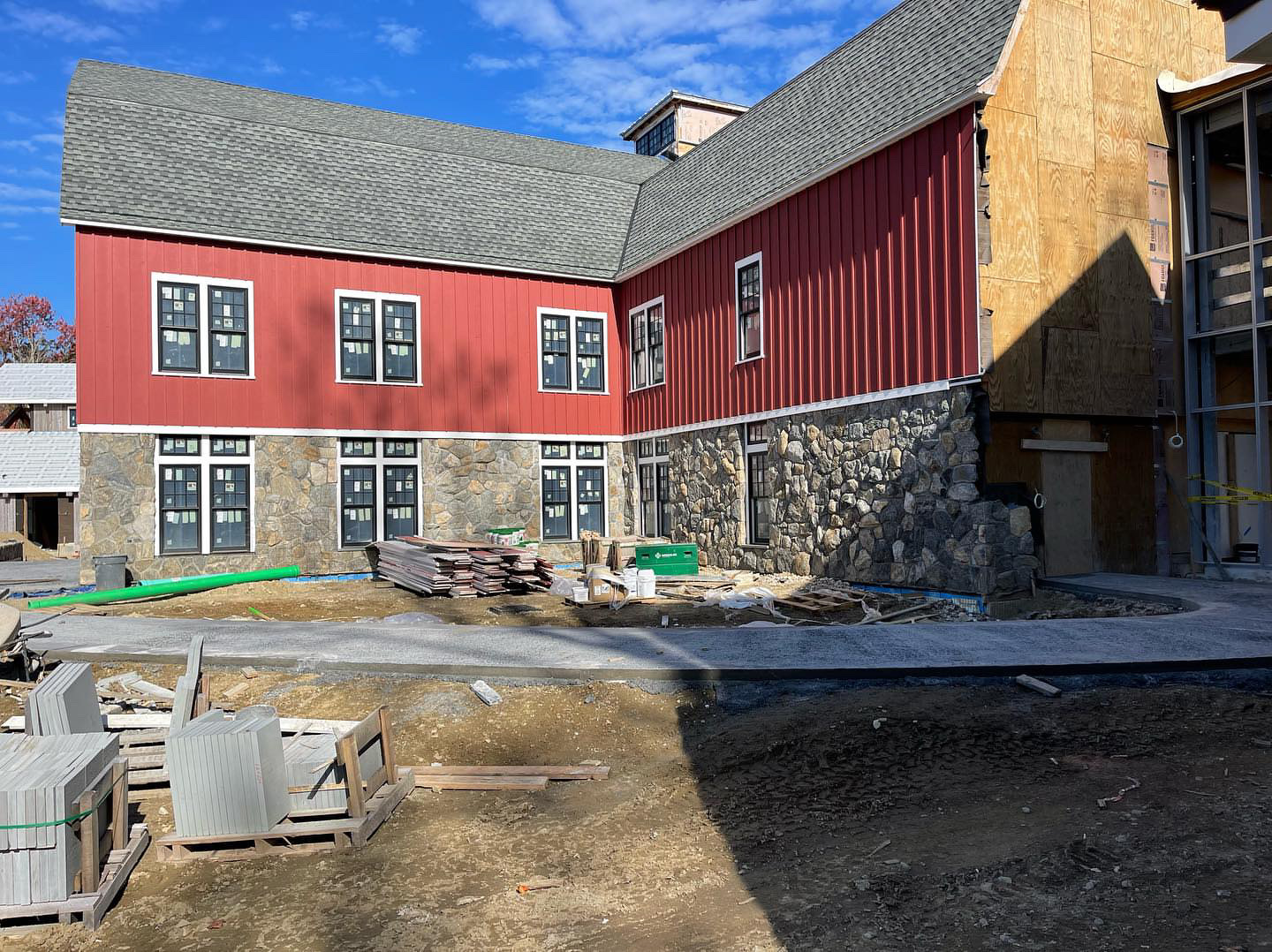 Commercial fieldstone veneer on a barn-style building with stone foundation